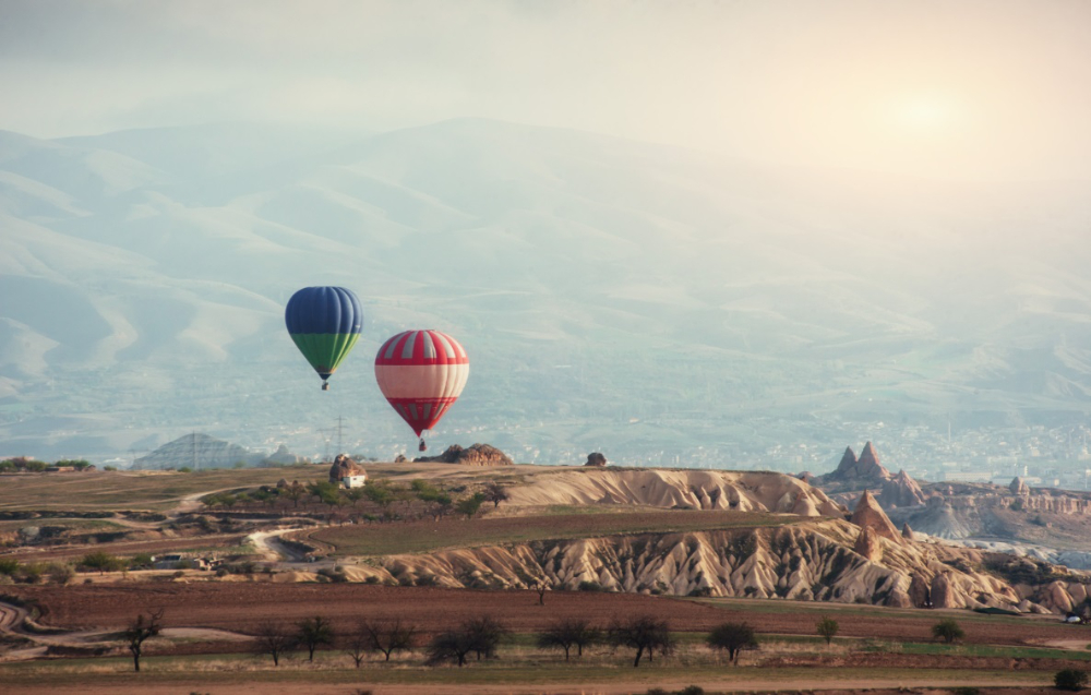 colorful-hot-air-balloons-flying-red-valley-cappadocia.jpg